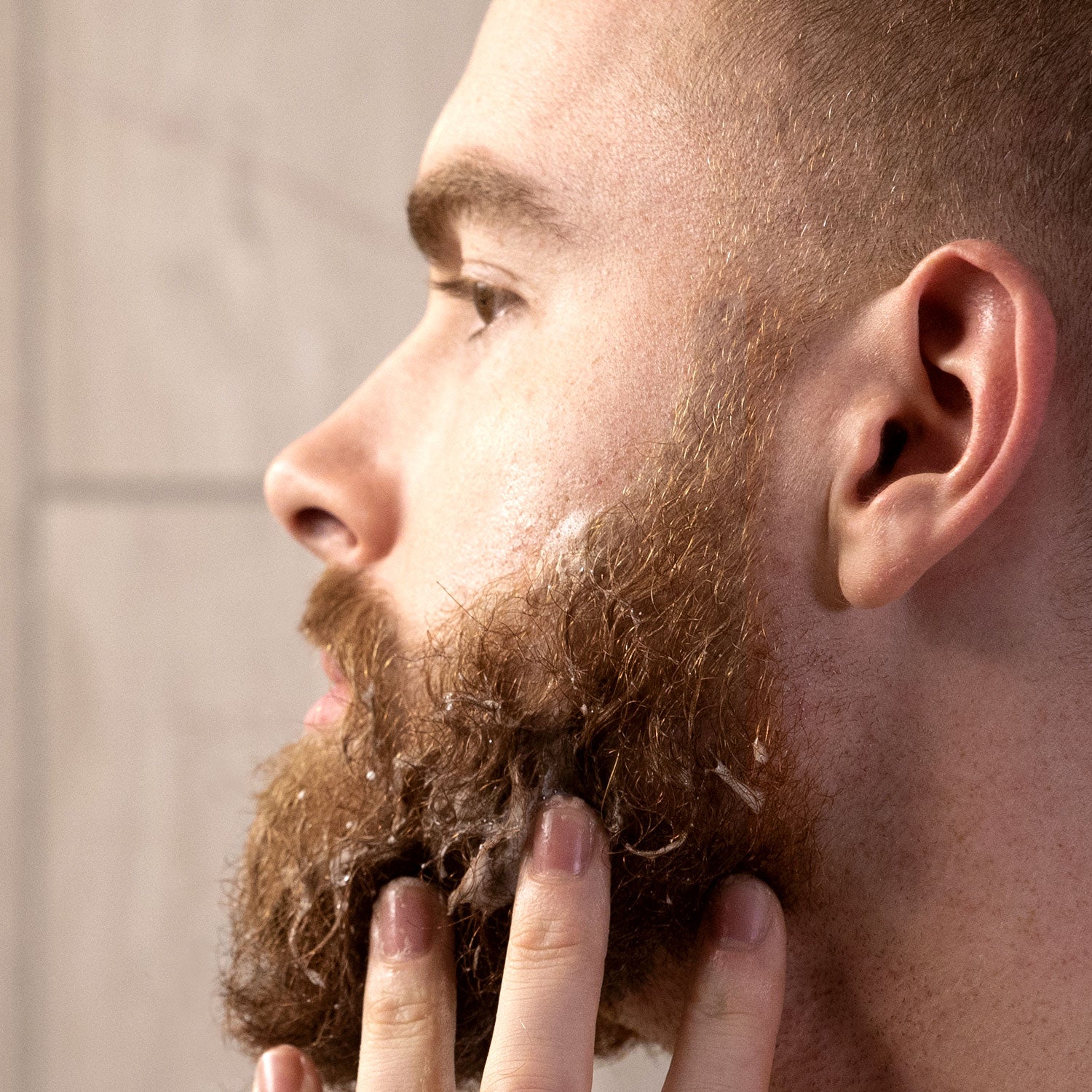 Foaming Sandalwood Beard Wash Being Worked Into Beard